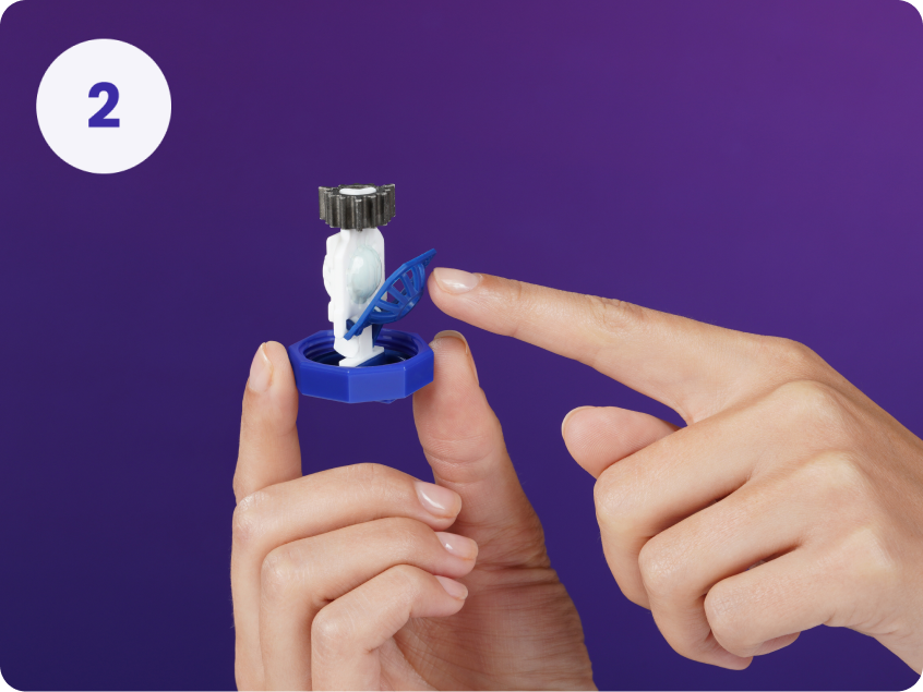 Number 2 - hand holding contact lens case lid pointing at open lens basket