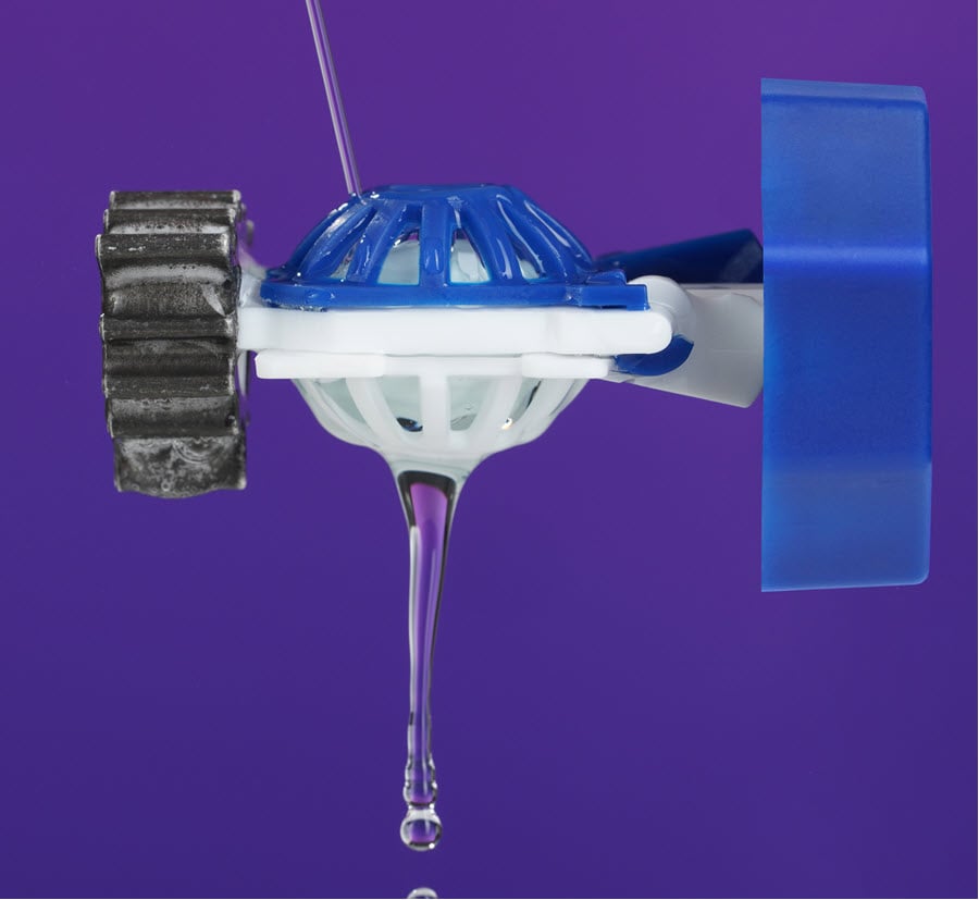 Number 2 - contact lens hydrogen peroxide solution applied to top of lens basket with solution dripping from the bottom of basket